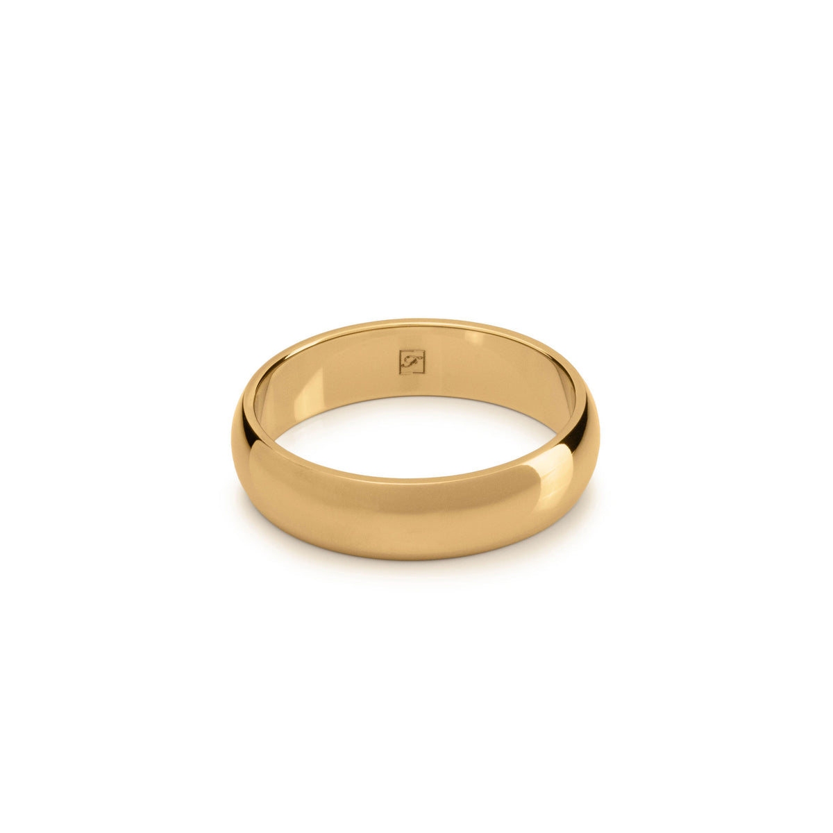 A gold-plated tungsten D shape ring lying flat on a white background.