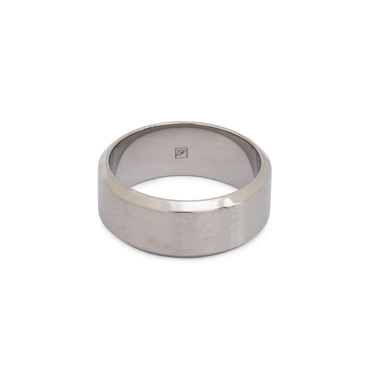 An 8mm tungsten ring with bevelled edges lying flat on a white background.