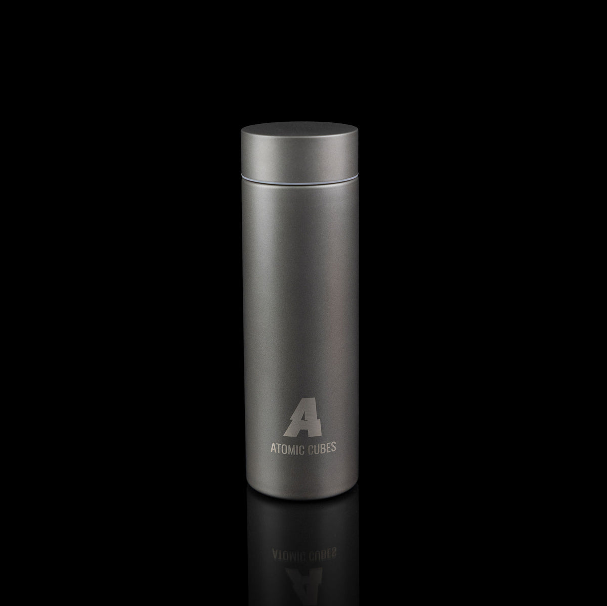 The 450ml titanium water bottle standing on a black background.